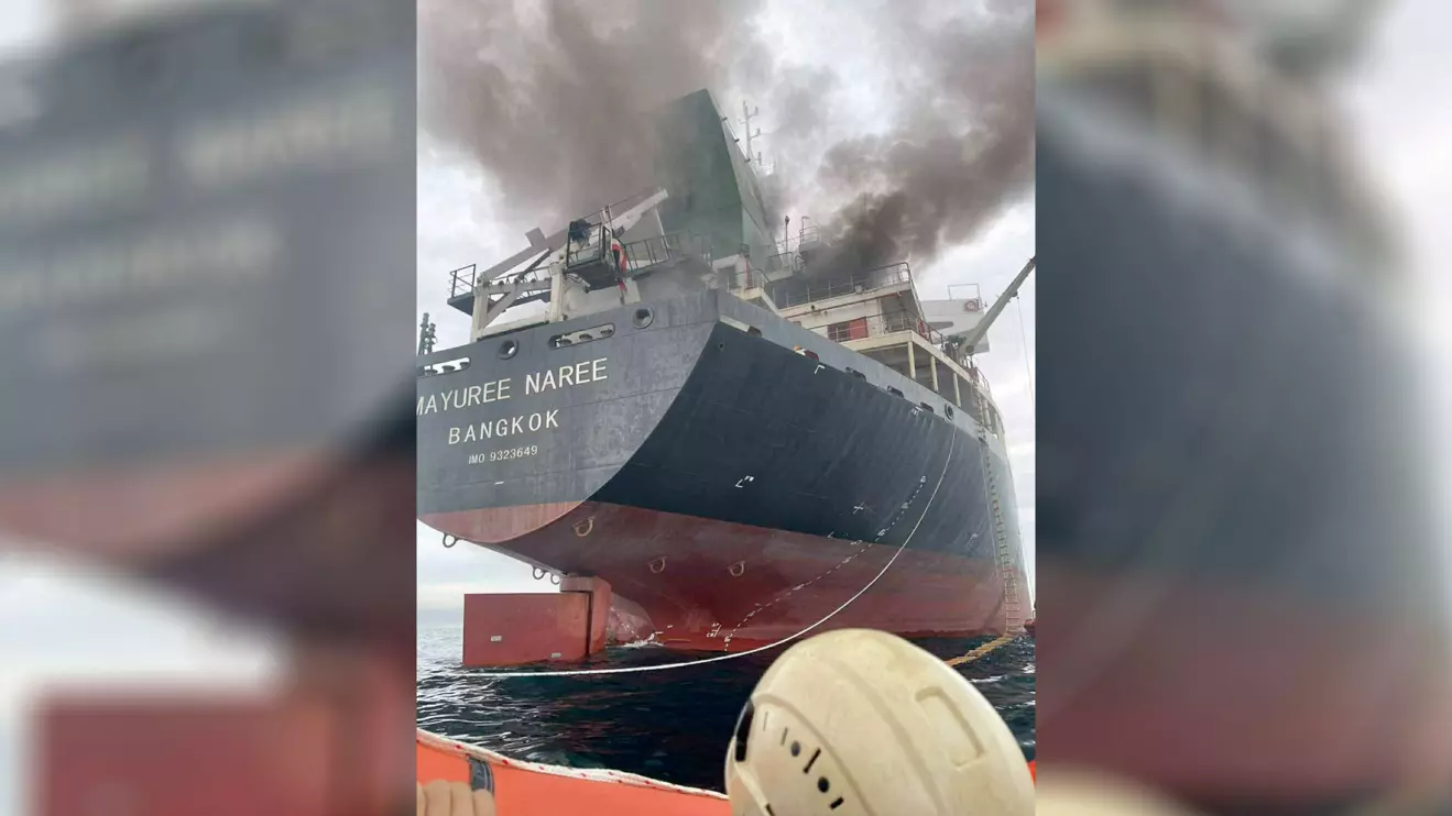 The Thailand-flagged cargo ship Mayuree Naree engulfed in black smoke in the Strait of Hormuz, March 11, 2026. ROYAL THAI NAVY