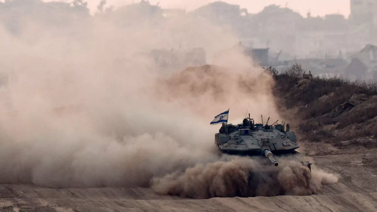 An Israeli tank manoeuvres in Gaza, as seen from the Israeli side of the border, Reuters/ Amir Cohen