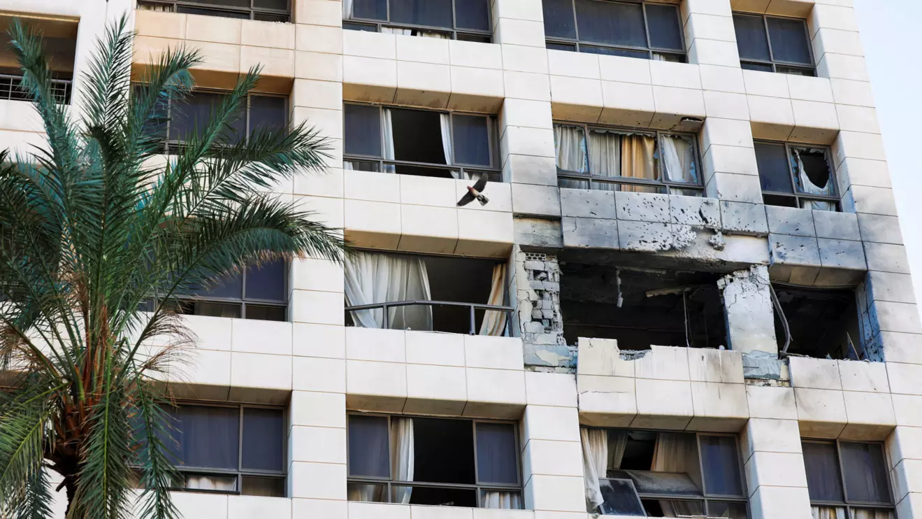 A bird flies next to the damaged Ramada Plaza hotel building in the aftermath of an Israeli strike, following an escalation between Hezbollah and Israel amid the U.S.-Israeli conflict with Iran, in central Beirut, Lebanon, March 8, 2026. REUTERS/Claudia Greco