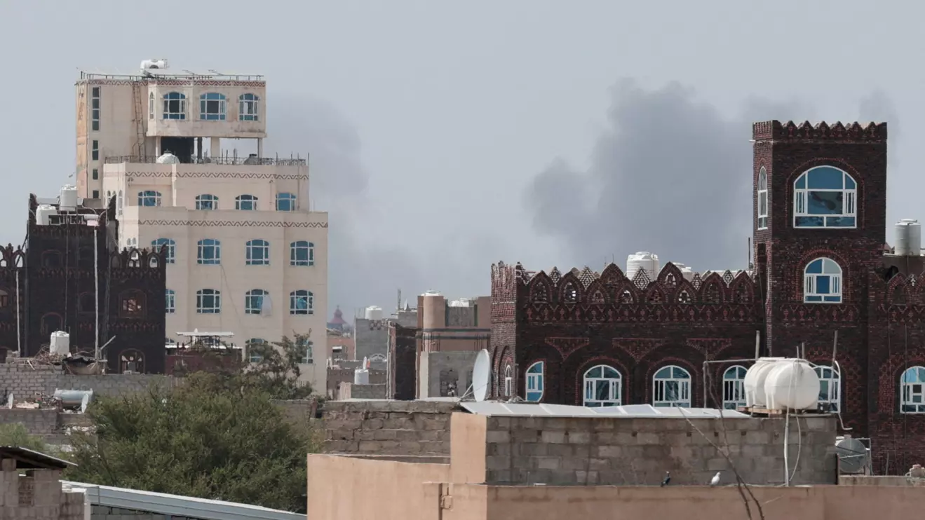 Smoke rises after reports of an airstrike hitting near the Sanaa International Airport, as seen from Sanaa, Yemen, July 13, 2026. Reuters/Khaled Abdullah