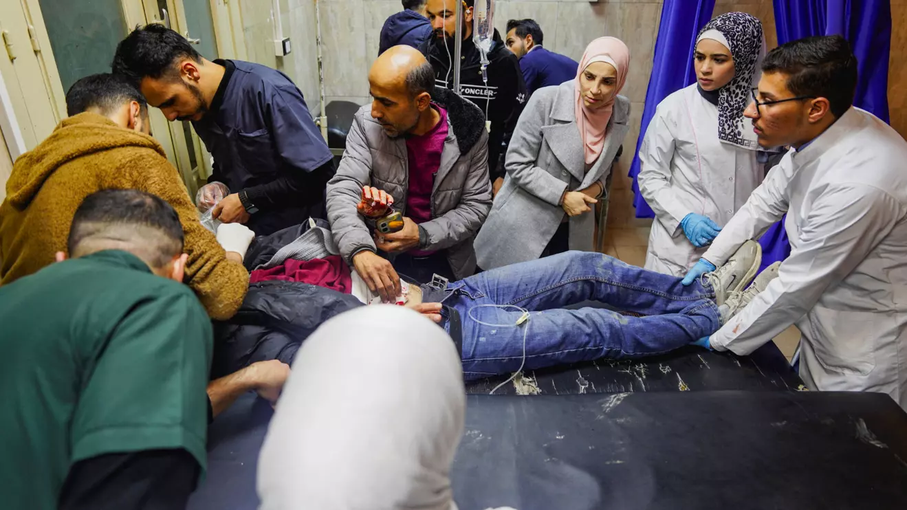 Paramedics place a wounded person on a stretcher inside a hospital, during a wave of attacks by government forces and the Kurdish-led Syrian Democratic Forces in the northern Syrian city of Aleppo, December 22, 2025. Reuters/Karam al-Masri