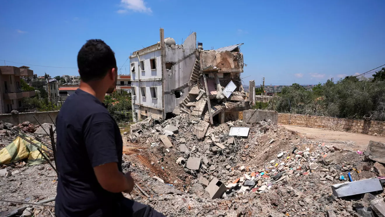 A man views the site of a previous Israeli strike in Kfar Sir in the Nabatieh district, Lebanon June 16, 2026, following a deal between the United States and Iran. Reuters