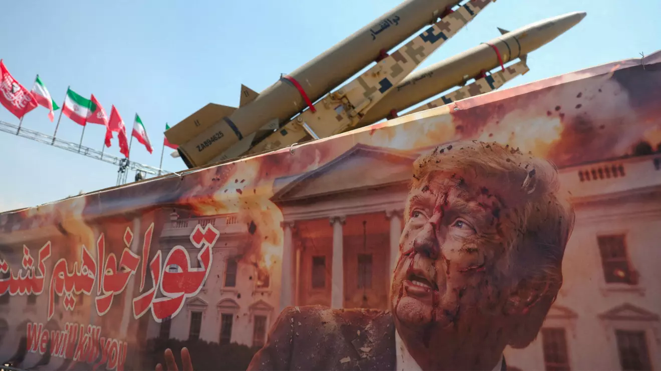 A banner with a picture of U.S. President Donald Trump next to an Iranian missile system at Azadi Square in Tehran, Iran, July 30, 2026. Majid Asgaripour/WANA (West Asia News Agency) via Reuters