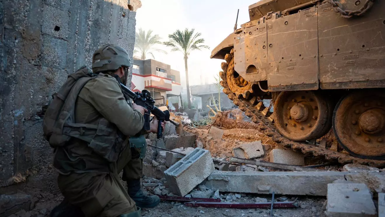 An Israeli soldier operates in the Gaza Strip, amid the ongoing conflict between Israel and the Palestinian Islamist group Hamas, in this handout picture released on December 20, 2023. Israel Defense Forces/Handout via Reuters