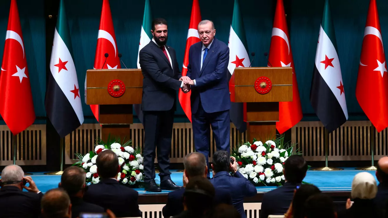 Syria's newly appointed president for a transitional phase Ahmed al-Sharaa and Turkey's President Tayyip Erdogan pose as they shake hands after a joint press conference at the Presidential Palace in Ankara, Turkey, February 4, 2025. Reuters/Cagla Gurdogan