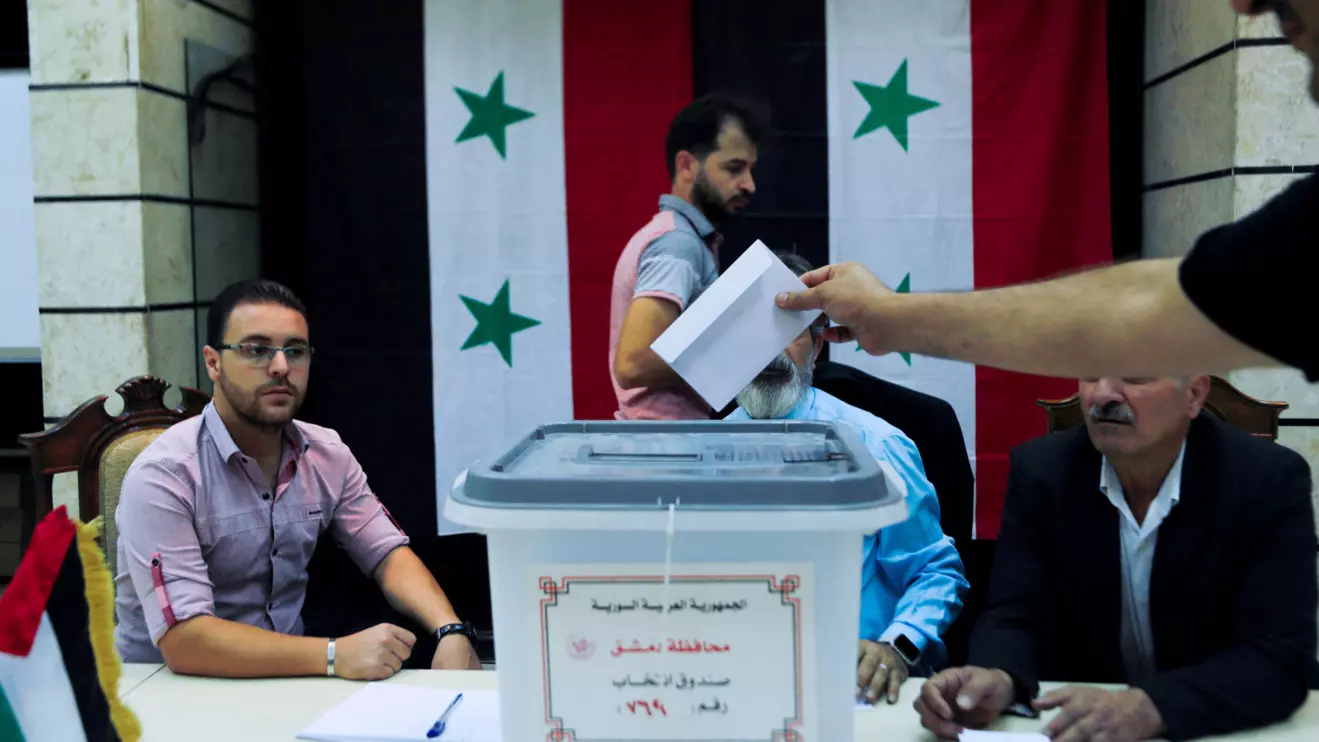 A man casts his ballot at a polling station during parliamentary elections, in Damascus, Syria July 15, 2024. Reuters/Yamam al Shaar