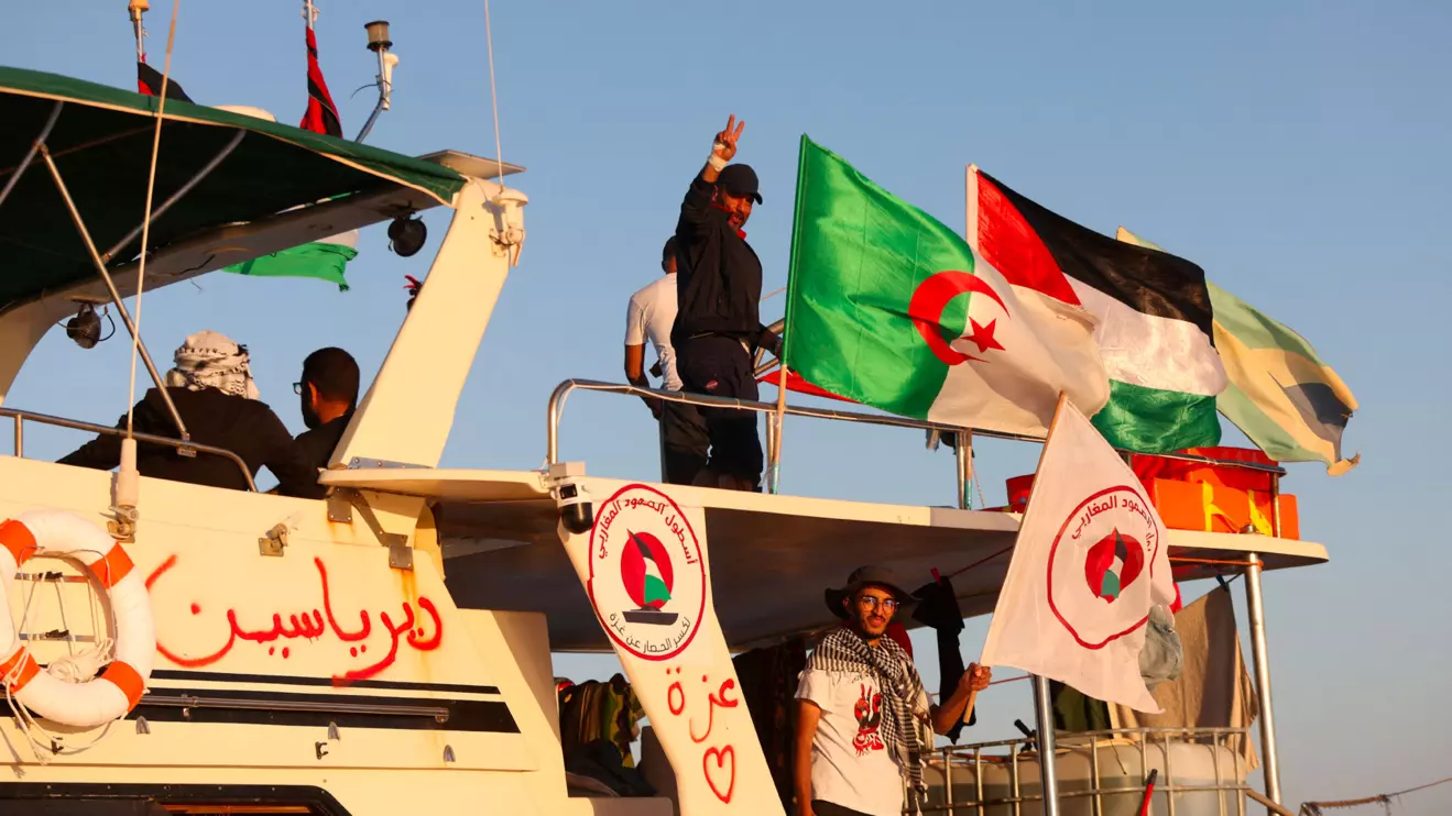 Crew interacts from aboard a boat, part of the Global Sumud Flotilla aiming to reach Gaza and break Israel's naval blockade, as it sails off Koufonisi islet, Greece, September 26, 2025. Reuters/Stefanos Rapanis