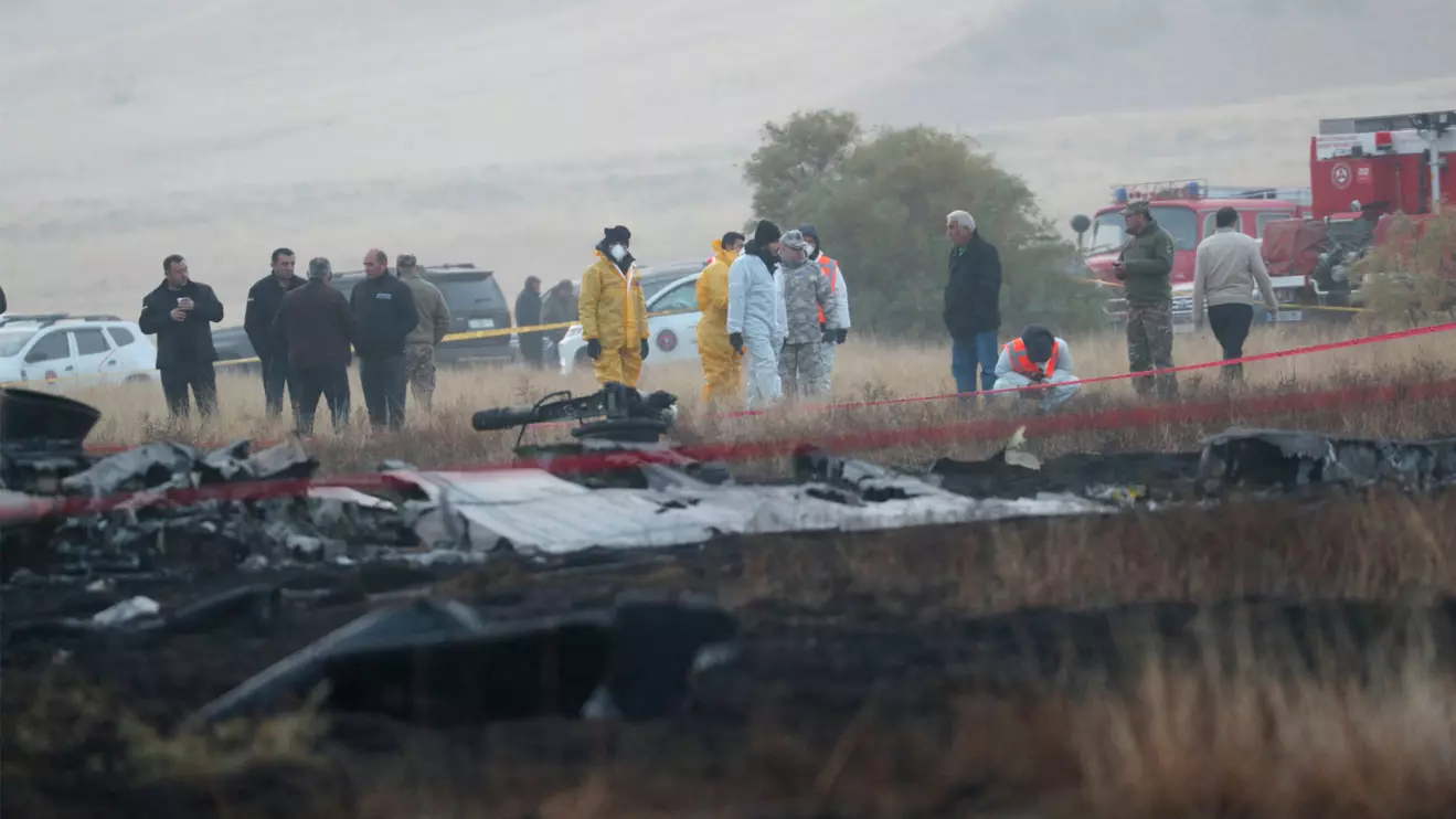 Members of emergency services work at the site of the Turkish C-130 military cargo plane crash near the Azerbaijani border, in Sighnaghi municipality, Georgia, November 12, 2025. Reuters/Irakli Gedenidze