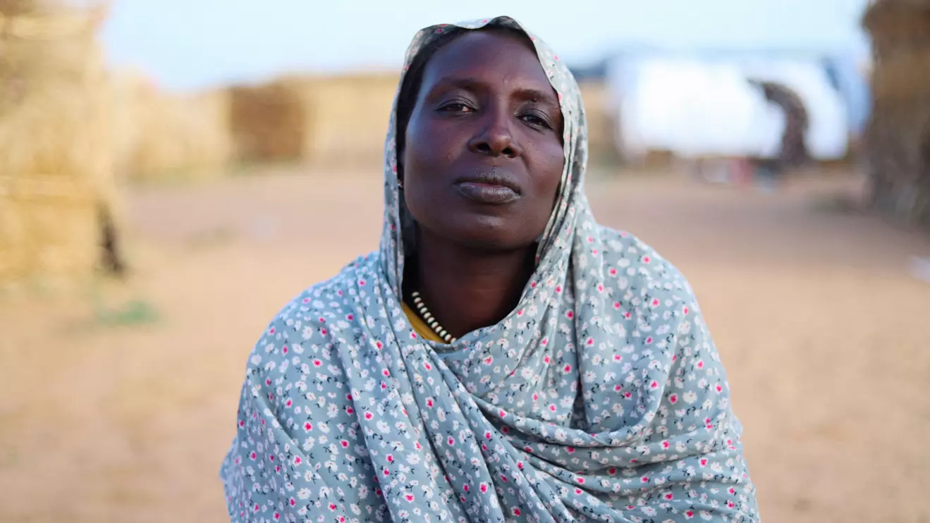 Hanan Adam Hassan, 39, a displaced Sudanese mother of five, including her child Enaam, looks on at a camp shelter amid the ongoing conflict between the paramilitary Rapid Support Forces (RSF) and the Sudanese army, in Tawila, North Darfur, Sudan, July 30, 2025. Reuters/Mohamed Jamal