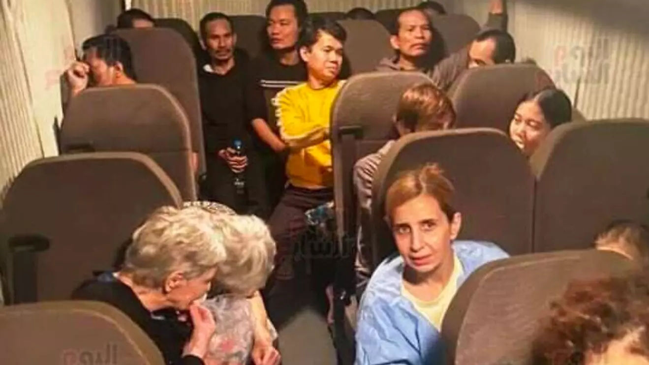 The hostages released by Hamas in an ambulance en route to Israel on November 24, 2023. (Screen capture/Youm7)