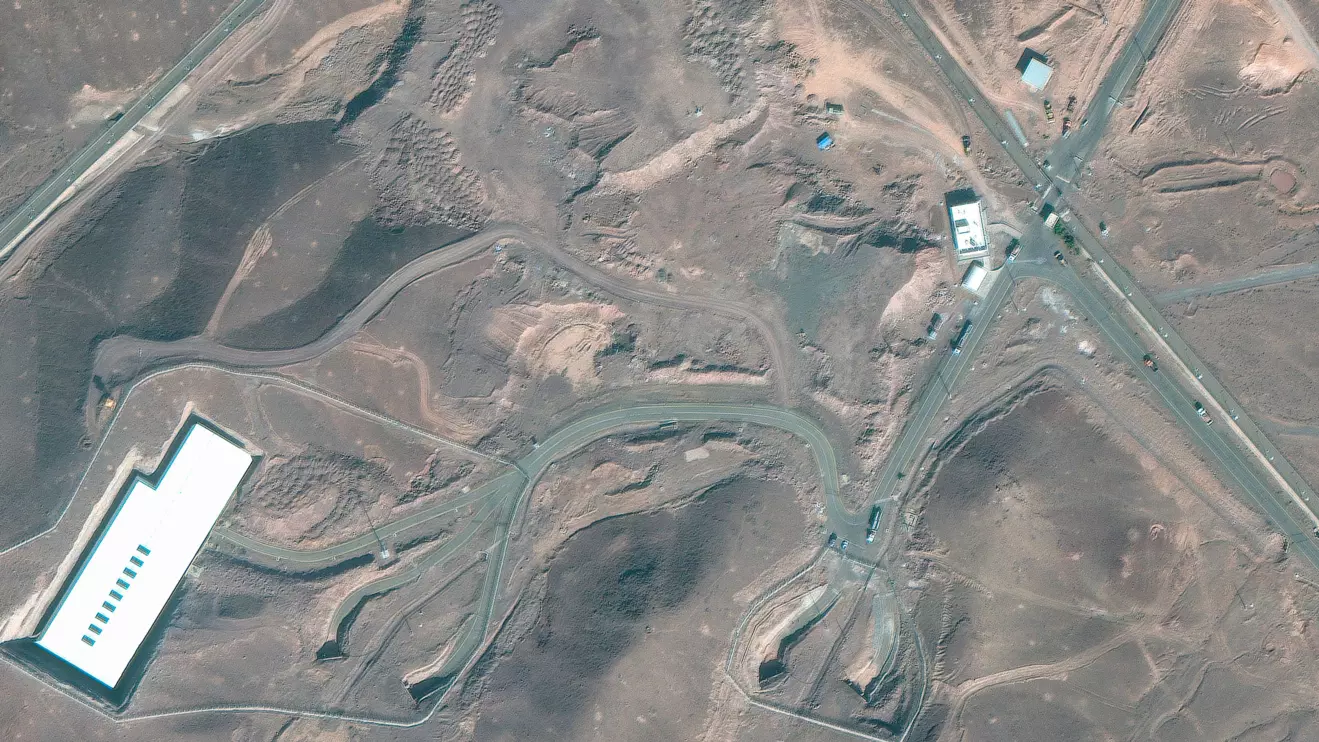 A satellite image shows trucks and bulldozers near the entrance to the Fordow nuclear facility, near Qom, Iran June 20, 2025. Maxar Technologies/Handout via Reuters