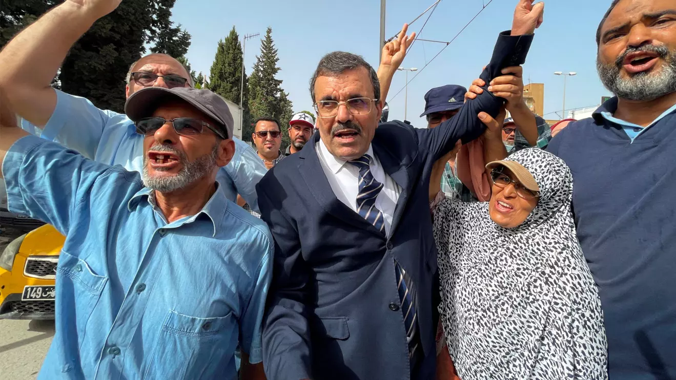 Ali Larayedh, senior official of Tunisia's Islamist opposition party Ennahda and former prime minister, gestures while surrounded by his supporters, upon his arrival for questioning by anti-terrorism police, in Tunis,Tunisia September 19, 2022. Reuters/Jihed Abidellaoui