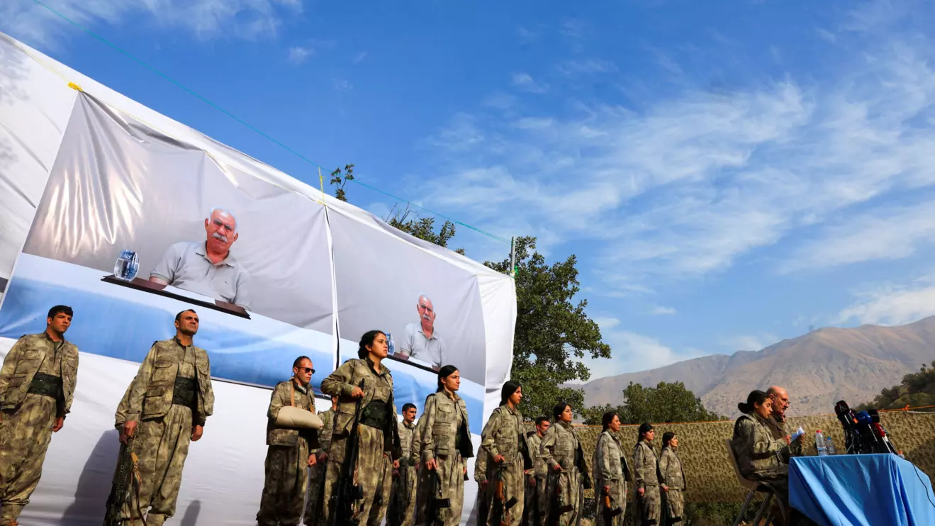 Fighters with the Kurdistan Workers' Party (PKK) line up during a disarmament ceremony marking a significant step toward ending the decades-long conflict between Turkey and the outlawed group in Qandil mountains, Iraq October 26, 2025. Reuters/Thaier Al-Sudani