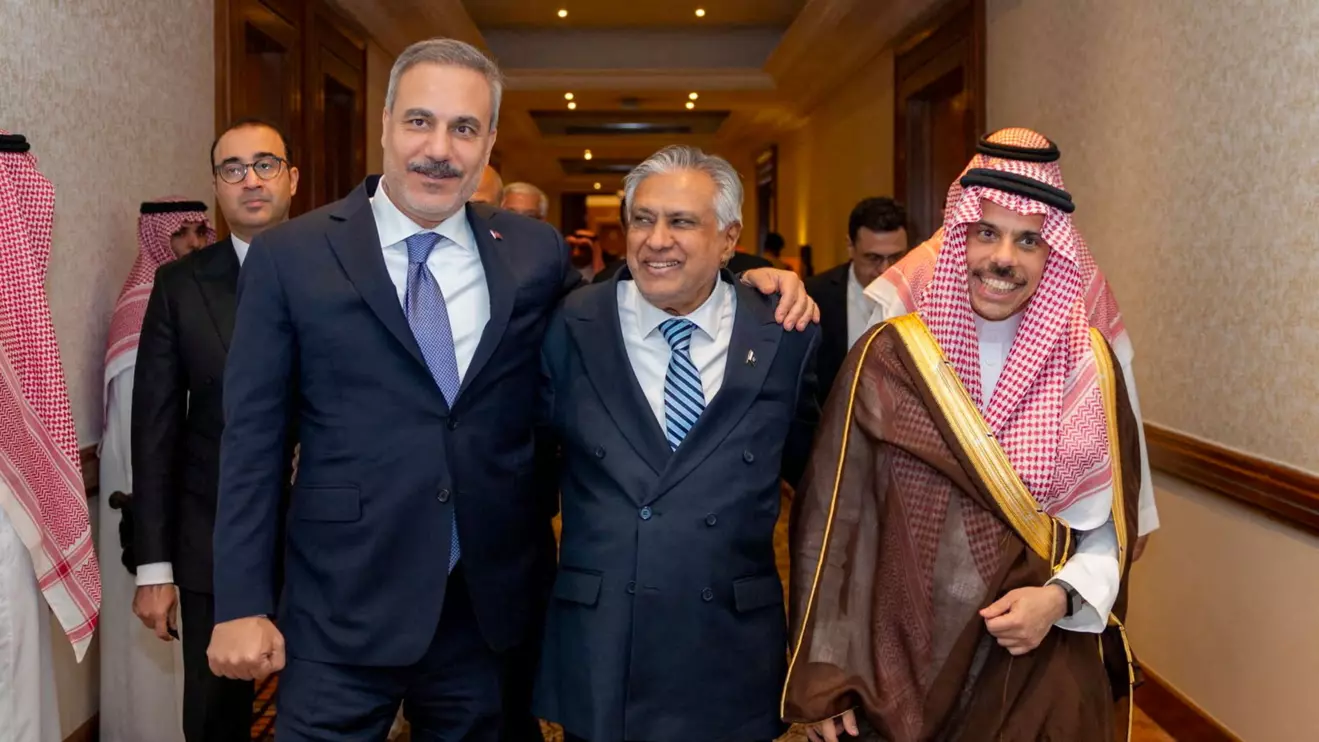 Turkey's Foreign Minister Hakan Fidan, Pakistan's Deputy Prime Minister and Foreign Minister Mohammad Ishaq Dar and Saudi Arabia's Foreign Minister Prince Faisal bin Farhan Al Saud leave after a committee meeting of Mecca defence pact in Riyadh, Saudi Arabia, October 5, 2026. Turkish Foreign Ministry