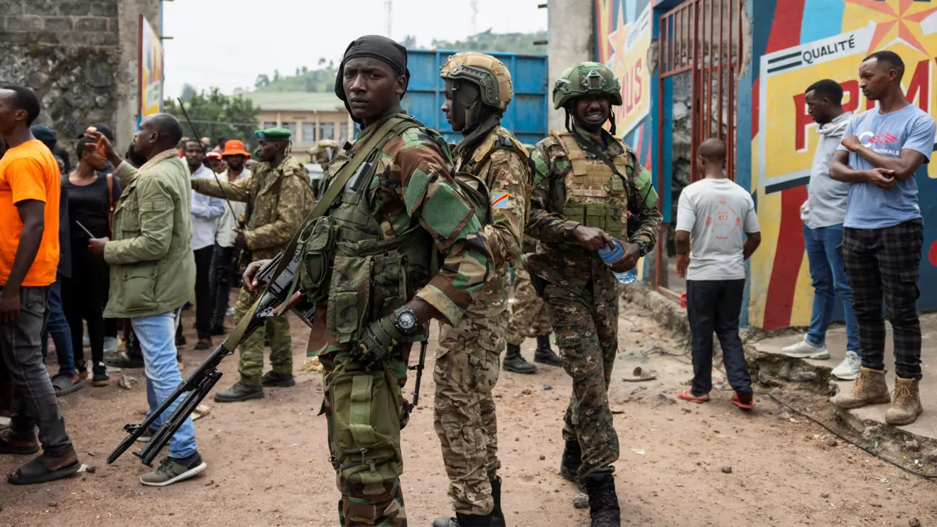 M23 rebels stand guard during a meeting organised by the M23 at the Stade de l'Unite, after the town of Goma was taken by the M23 rebels, in Goma, Democratic Republic of Congo, February 6, 2025. Reuters/Arlette Bashizi