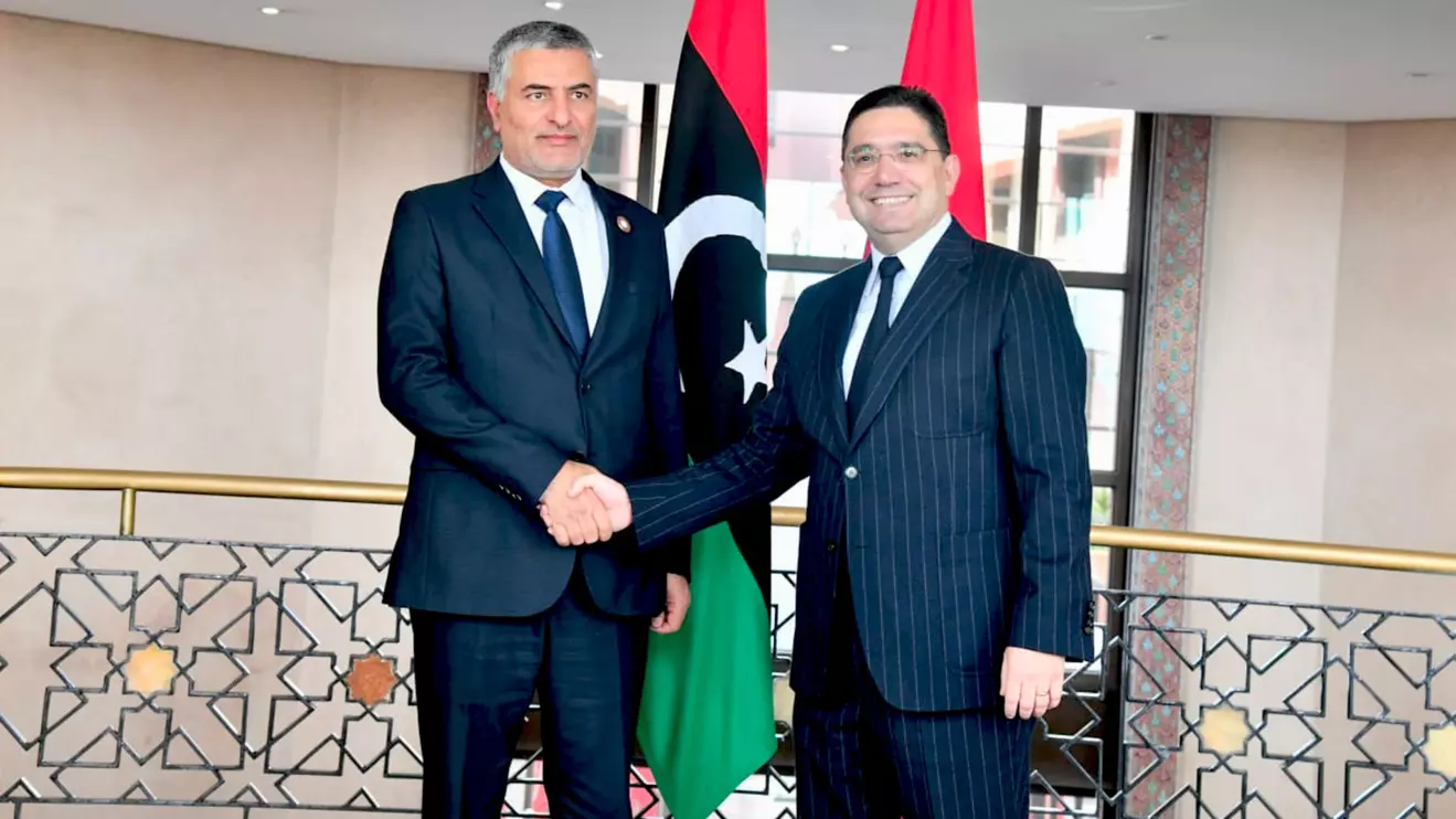 Muhammad Meftah Takala (L) and Nasser Bourita 