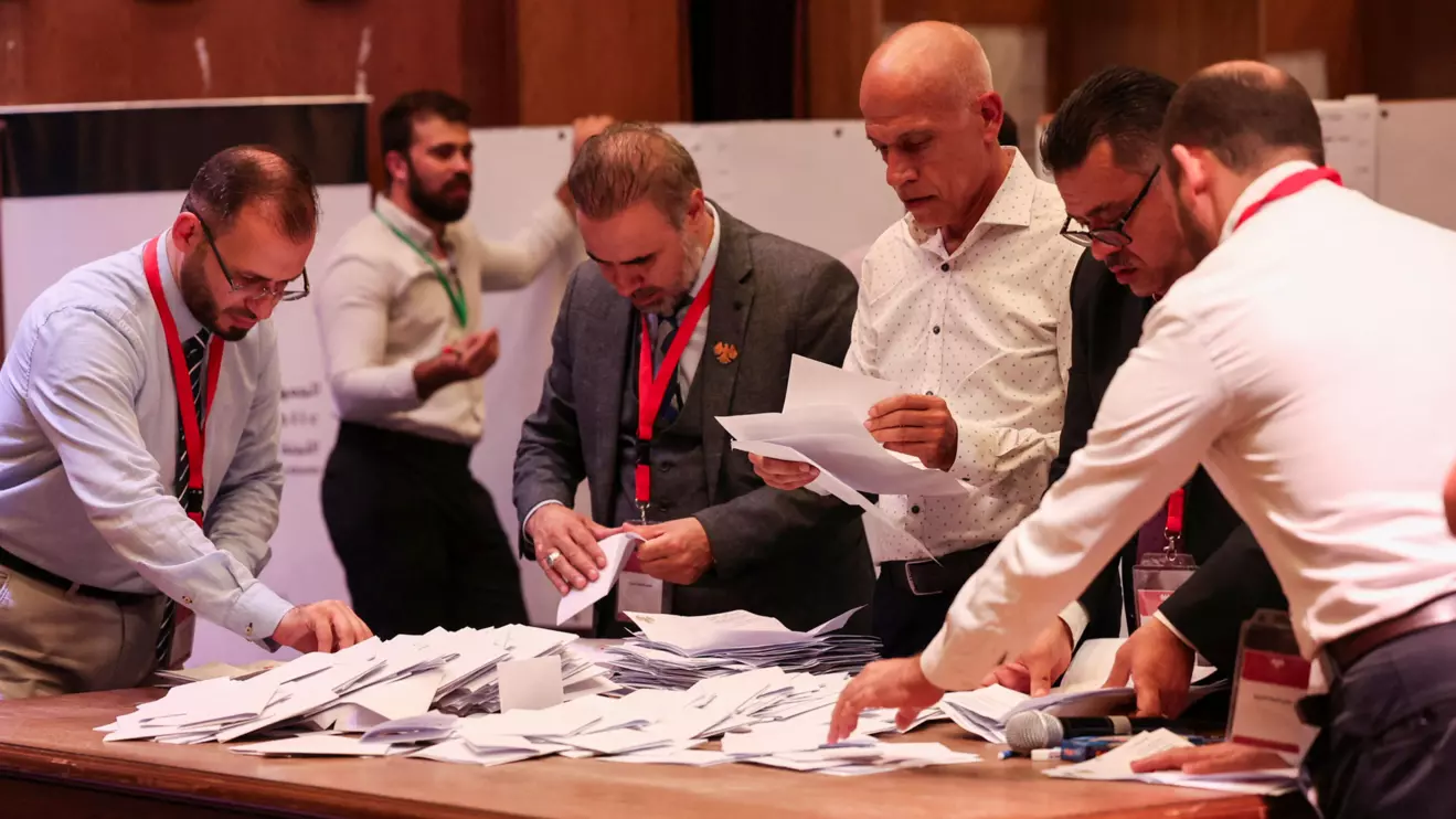 Members of electoral colleges count votes, on the day they vote for candidates of the new Syrian Parliament since Bashar al-Assad's government was toppled, in Aleppo, Syria, October 5, 2025. Reuters/Mahmoud Hassano