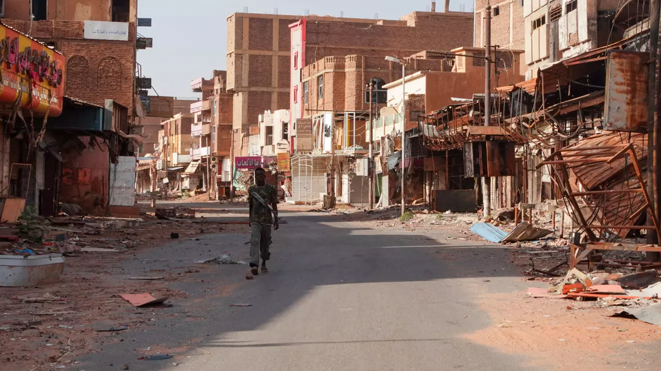 A member of the Sudanese Armed forces walks between damaged buildings, almost one year into the war between the Sudanese Armed Forces and the paramilitary Rapid Support Forces (RSF), in Omdurman, Sudan, April 7, 2024. Reuters/El Tayeb Siddig