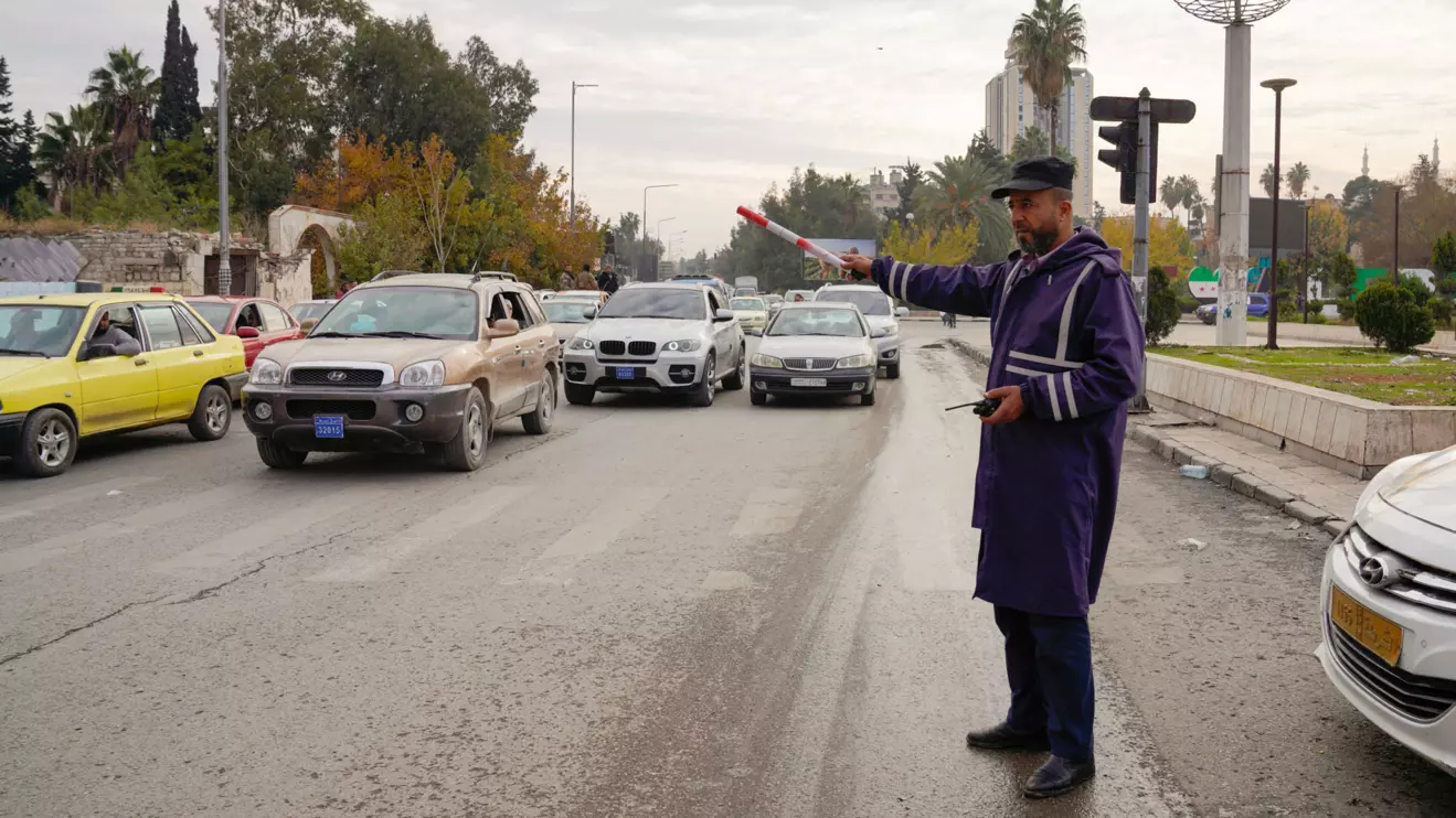 A traffic police directs cars, after rebels took the main northern city of Aleppo and have since pushed south from their enclave in northwest of the country, in Aleppo, Syria, December 4, 2024. Reuters/Karam al-Masri