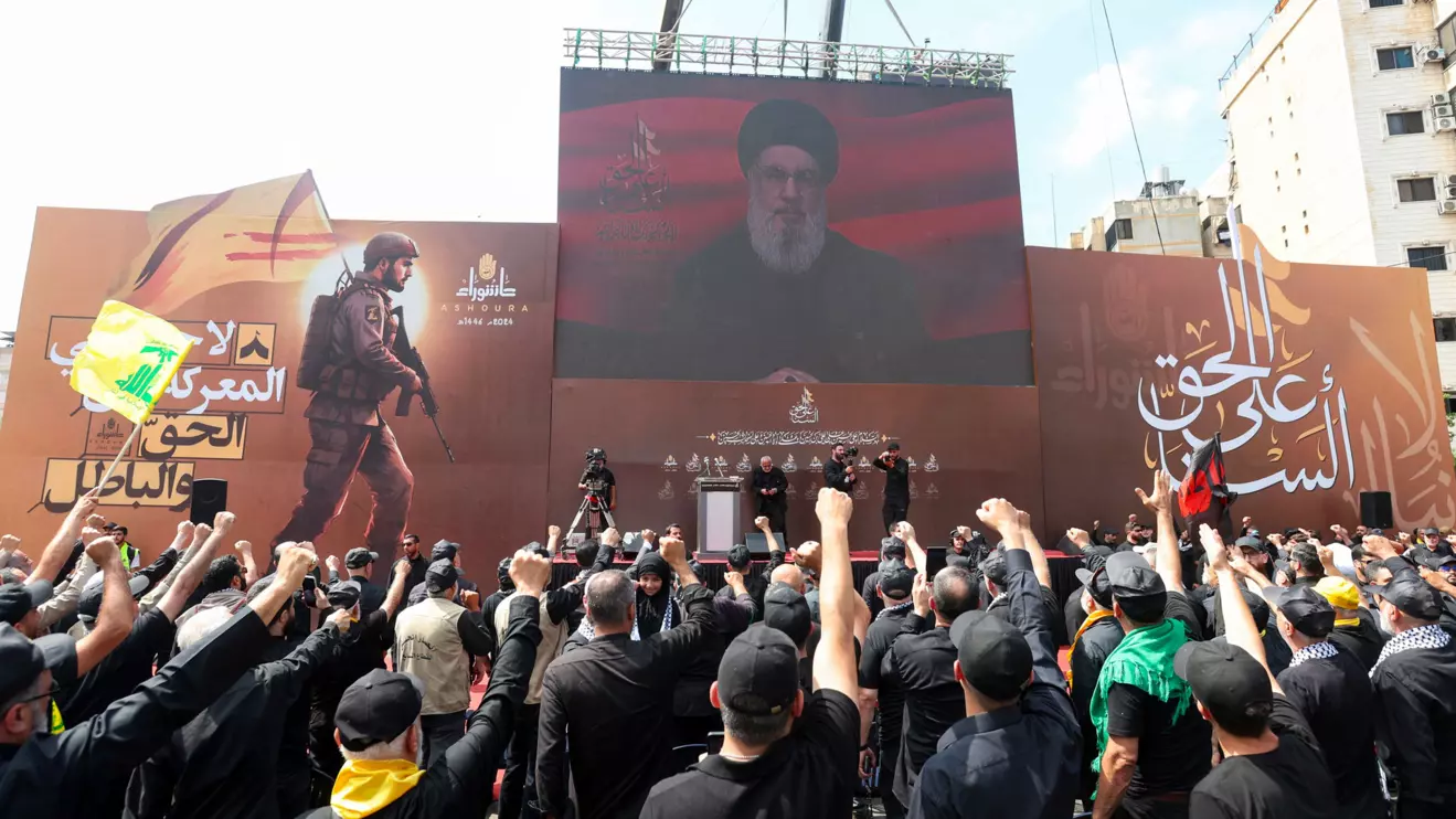 Lebanon's Hezbollah leader Sayyed Hassan Nasrallah appears on a screen as he addresses his supporters during a religious procession to mark Ashura in Beirut's southern suburbs, Lebanon July 17, 2024. Reuters/Aziz Taher