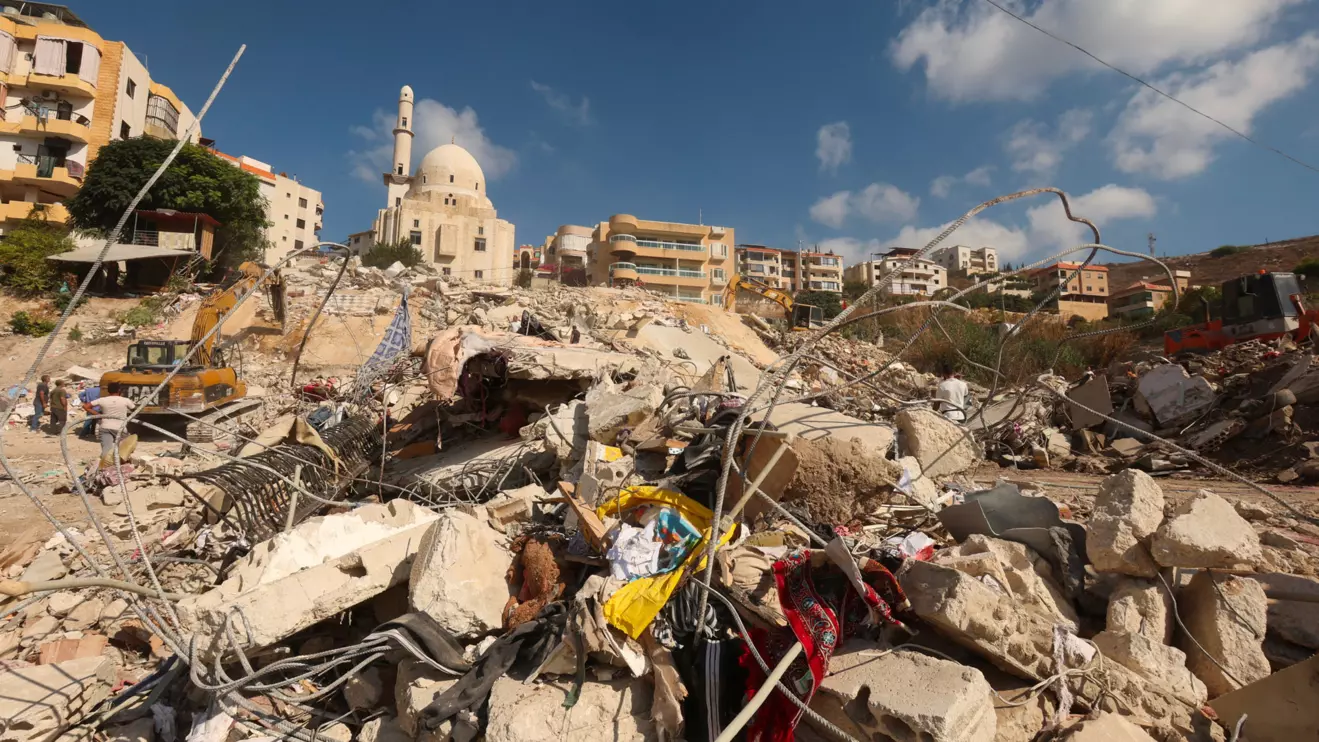 People inspect the damage at the site of Sunday's Israeli attack on the city of Ain Deleb, amid the ongoing hostilities between Hezbollah and Israeli forces, in southern Lebanon September 30, 2024. Reuters/Aziz Taher