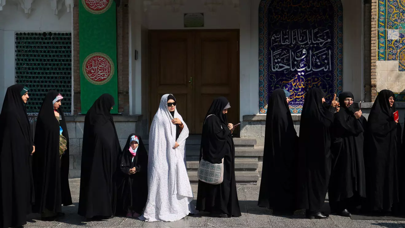 Iranians wait in line to vote at a polling station during parliamentary elections in Tehran, Iran, March 1, 2024. Majid Asgaripour/WANA (West Asia News Agency) via Reuters