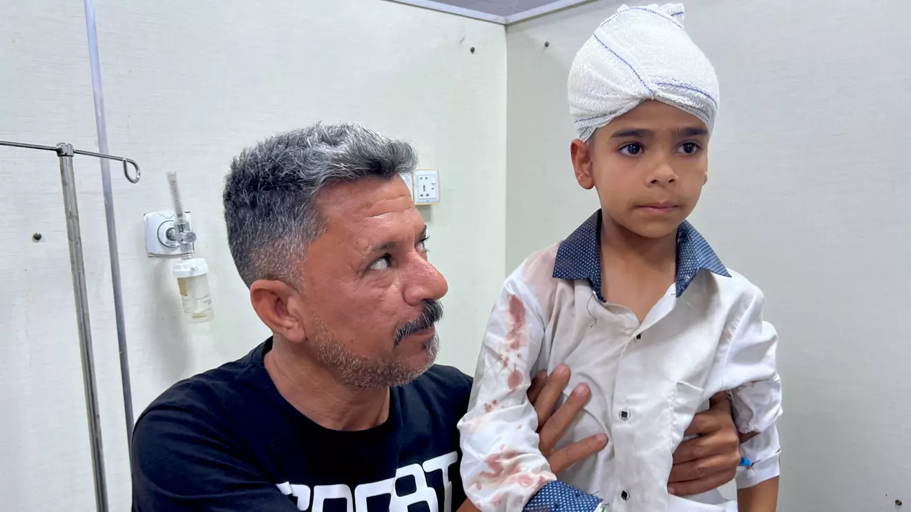 A child receives medical care at a hospital after six primary-school students were killed and 14 others were injured when a refrigerator truck veered into a group of children in Basra, April 2, 2024. Reuters/Mohammed Aty