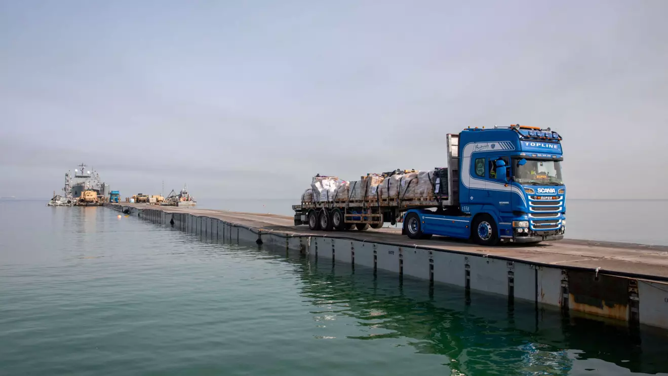 A truck carries humanitarian aid across Trident Pier, a temporary pier to deliver aid, off the Gaza Strip, amid the ongoing conflict between Israel and the Palestinian Islamist group Hamas, near the Gaza coast, May 19, 2024. U.S. Army Central/Handout via Reuters