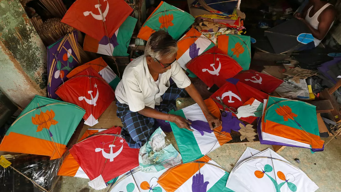 A kite-maker prepares kites with election symbols of Indian political parties at his shop ahead of India's general election, in Kolkata, Reuters/Rupak De Chowdhuri