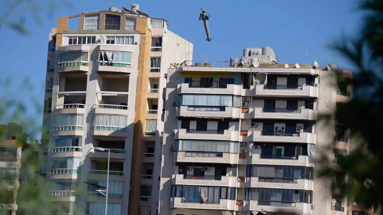 A missile flies towards a building, amid ongoing hostilities between Hezbollah and Israeli forces, in Beirut's southern suburbs, Lebanon, October 22, 2024 in this still image obtained from social media video. @MHMD.HSN.SALAMI VIA INSTAGRAM/via Reuters
