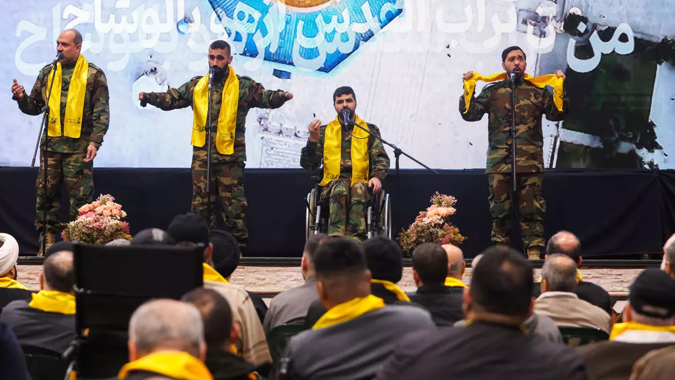Hezbollah veterans perform on stage before Lebanon's Hezbollah leader Sayyed Hassan Nasrallah addresses his supporters via a screen during a rally in southern suburbs in Beirut, February 13, 2024. Reuters/Aziz Taher