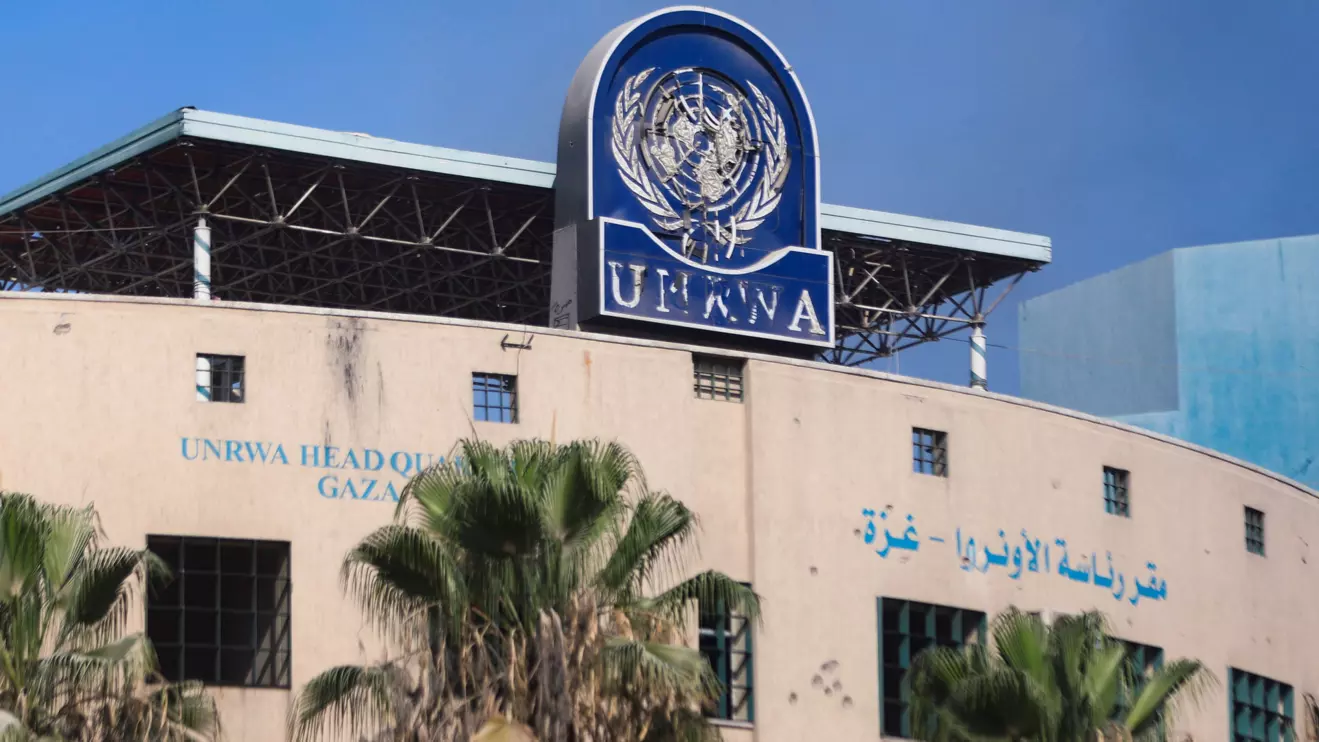 A damaged sign is pictured at the headquarters of UNRWA, following an Israeli raid, amid the Israel-Hamas conflict, in Gaza City, July 12, 2024. Reuters/Dawoud Abu Alkas