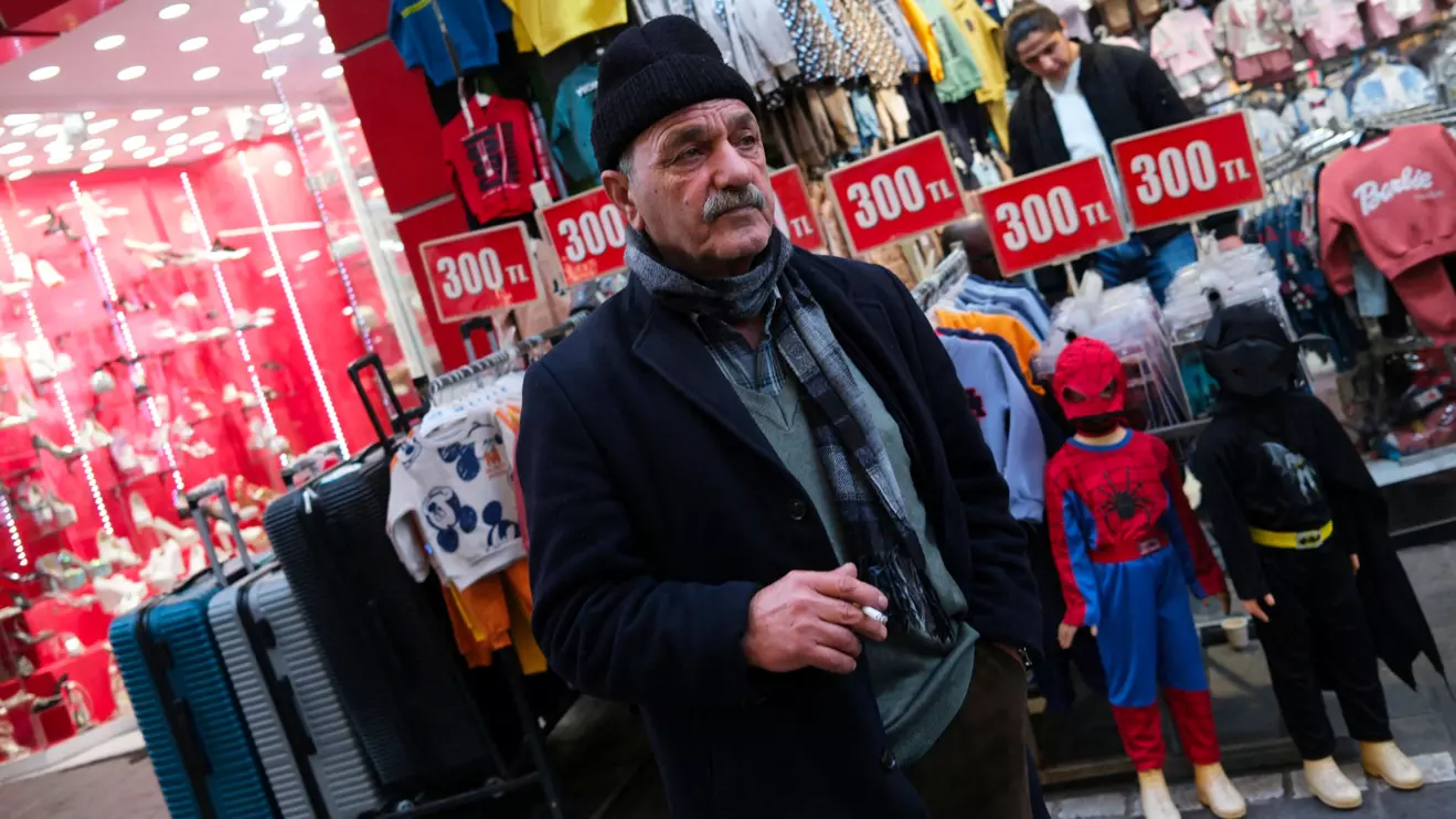 A man pauses in front of a shop in a popular middle-class shopping district in Istanbul, Reuters/Murad Sezer