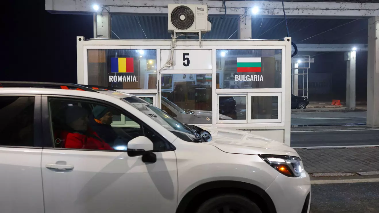 A car passes by a now vacant border guards stall as Romania and Bulgaria both join the Schengen bloc, at the Romanian - Bulgarian customs point in Giurgiu, Romania, January 1, 2025. Inquam Photos/George Calin via Reuters