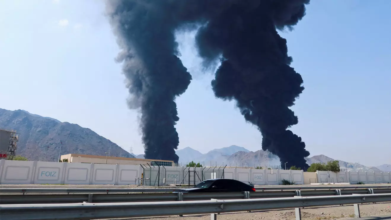 Smoke rises in the Fujairah oil industry zone, caused by debris after interception of a drone by air defenses, according to the Fujairah media office, amid the U.S.-Israel conflict with Iran, in Fujairah, United Arab Emirates, March 14, 2026. Reuters