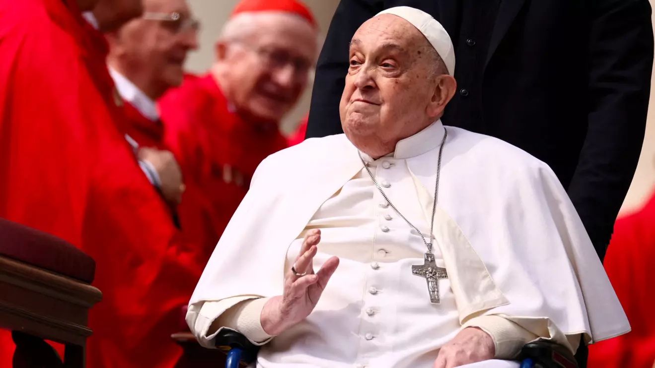 Pope Francis greets cardinals as he unexpectedly appears during the Palm Sunday Mass in Saint Peter's Square at the Vatican, April 13, 2025. Reuters/Yara Nardi