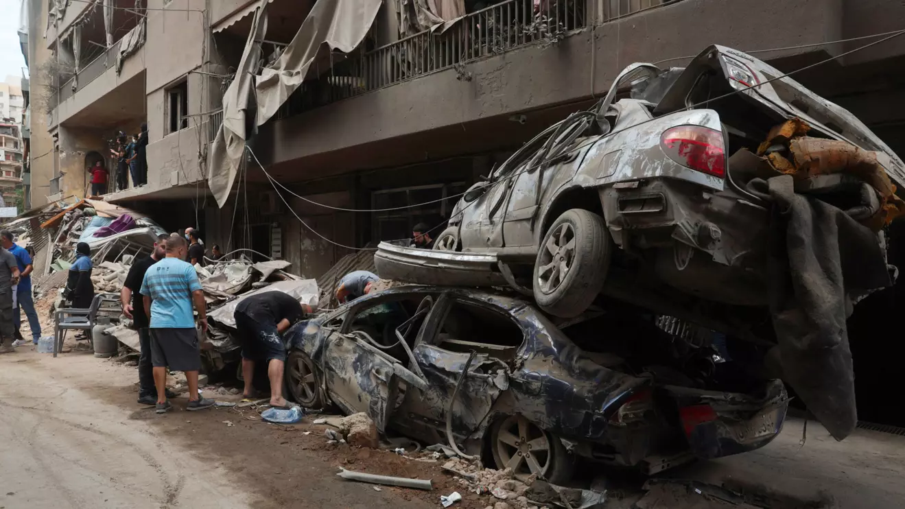 People inspect the damages at a site of an Israeli strike, amid ongoing hostilities between Hezbollah and Israeli forces, in Beirut, Lebanon, October 12, 2024. Reuters/Emilie Madi