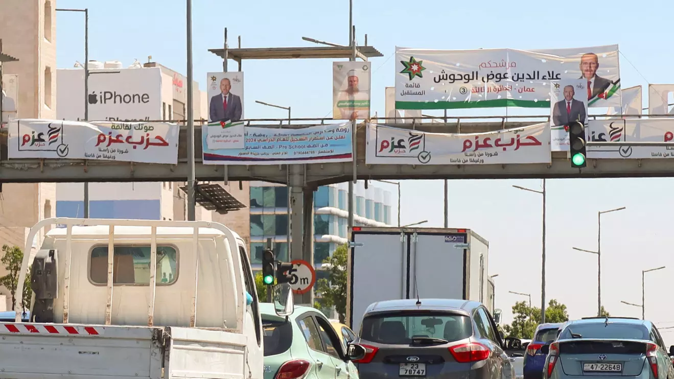 Cars pass near banners and pictures of candidates running in the country's parliamentary election in Amman, Jordan September 7, 2024. Reuters/Jehad Shelbak