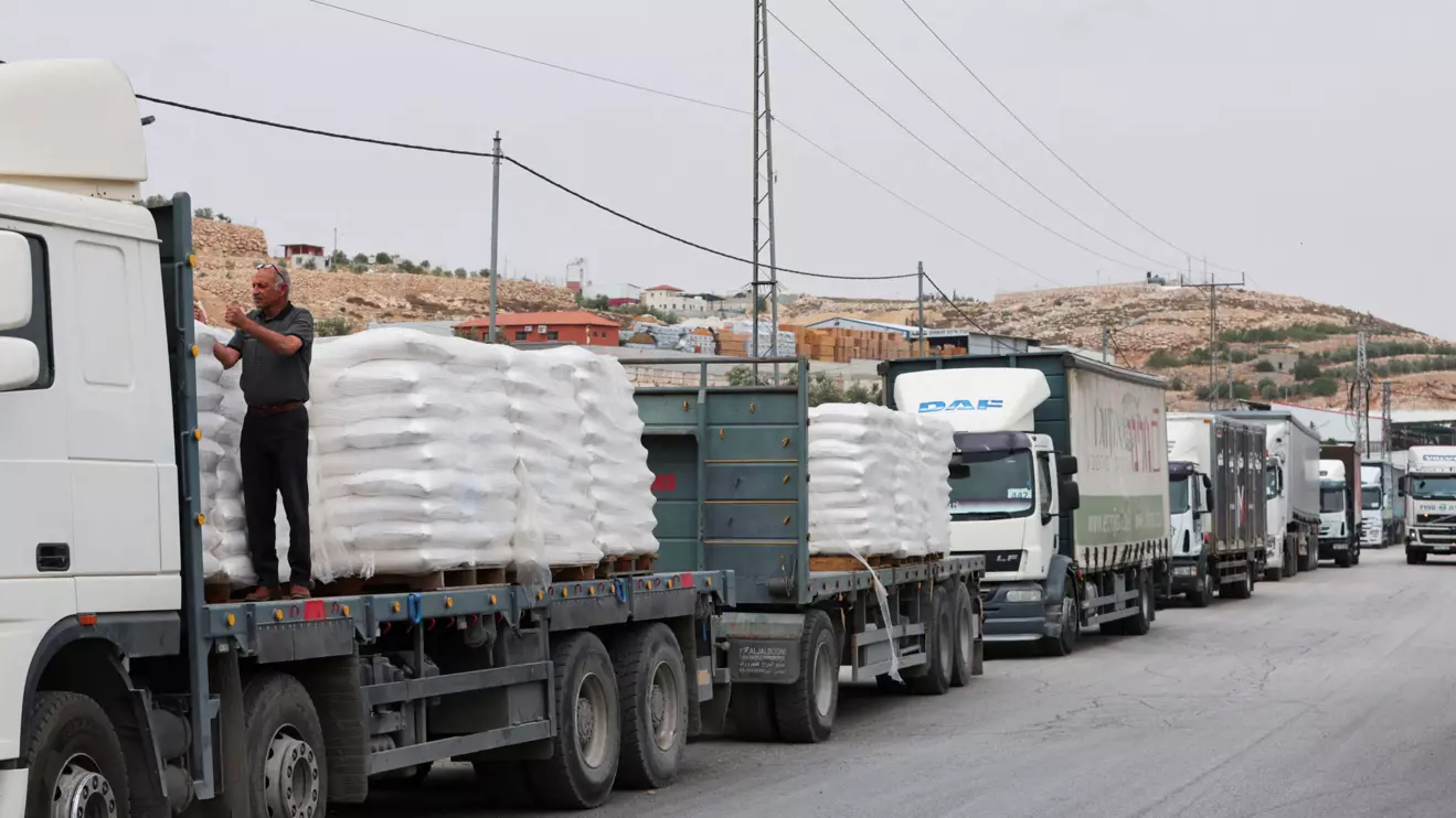 Commercial food trucks are seen near a checkpoint near Hebron, amid the ongoing conflict in Gaza between Israel and the Palestinian Islamist group Hamas, in the Israeli-occupied West Bank May 28, 2024. Reuters/Mussa Qawasma