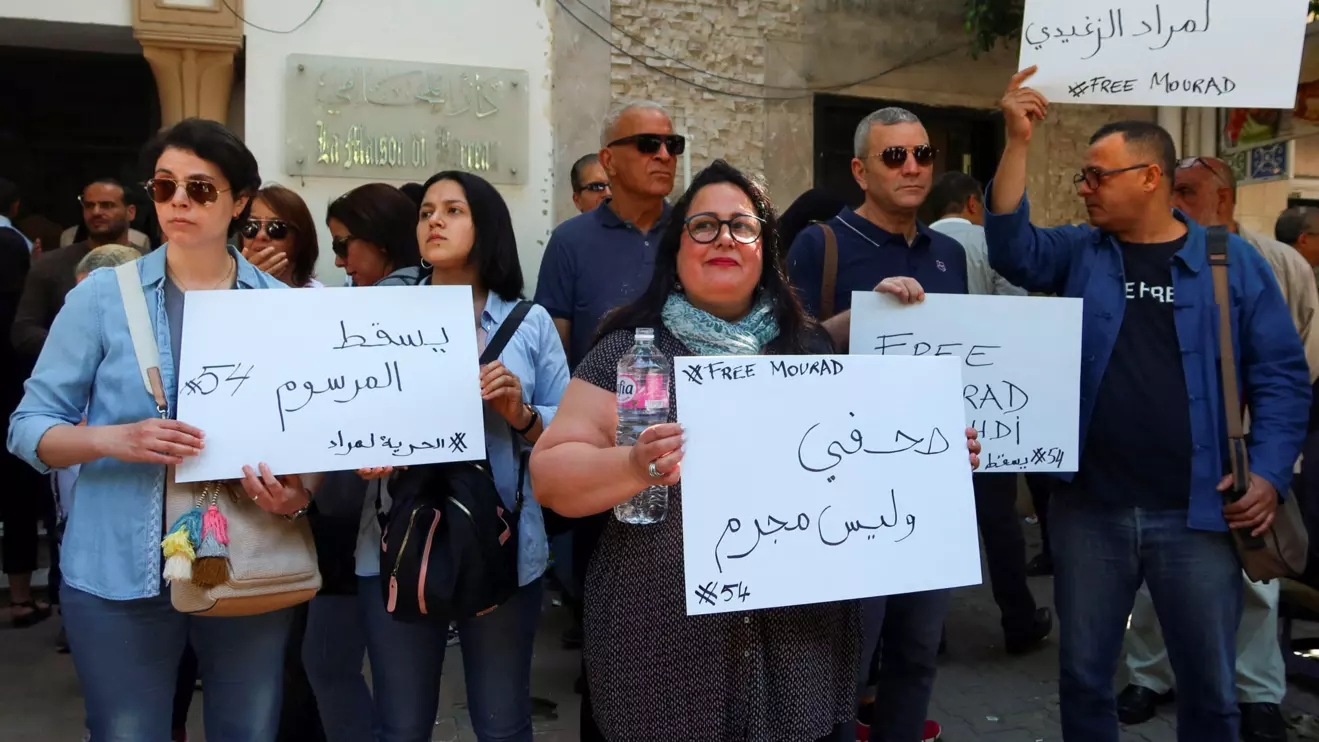 Relatives of Mourad Zghidi, IFM radio journalist who was arrested with another colleague, Borhen Bsaiss, over radio comments and social media posts, according their lawyers, carry banners as they call for his release outside the building of the Deanship of Lawyers in Tunis, May 13, 2024. Reuters/Jihed Abidellaoui