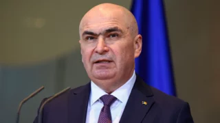 Romanian PM says he'll lead minority government after leftist Social Democrats walk out