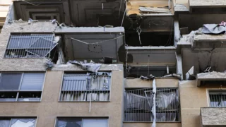 Air strikes reported across the Middle East, Iran clamps down on dissent