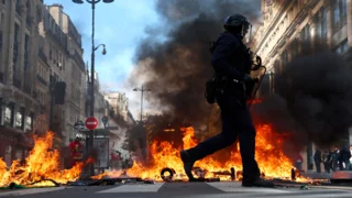 French police clash with protesters as tens of thousands rally over cost of living