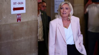 French court opens door for Marine Le Pen to run for president, with ankle tag