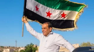 Syria detains convicted former Assad officer after return from Austria