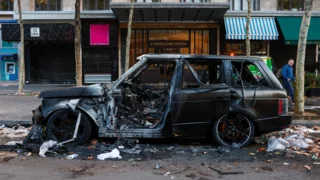 Macron urges calm as France counts the cost of worst unrest in years