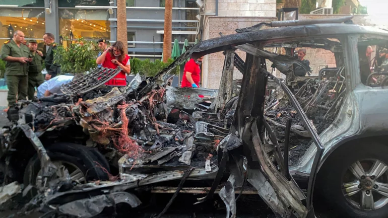 One killed in missile attack on car in Syrian capital, state media say