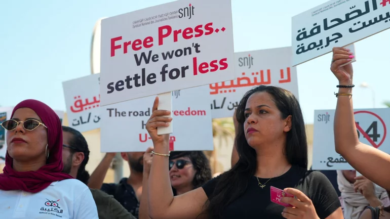Journalists rally as Tunisia's media crackdown deepens