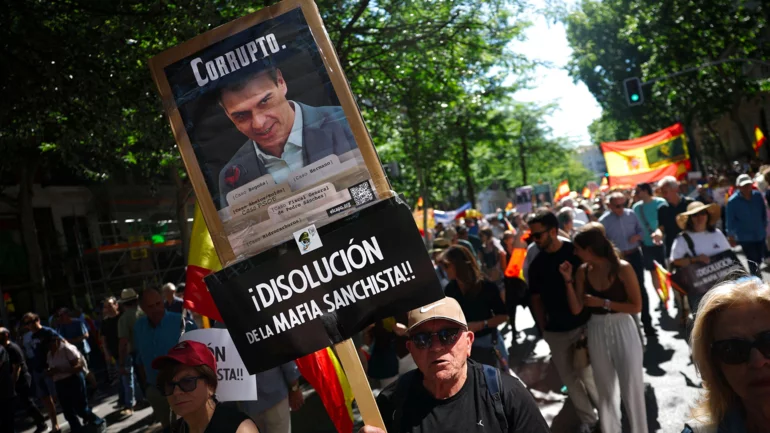 Tens of thousands march in Madrid to demand prime minister's resignation