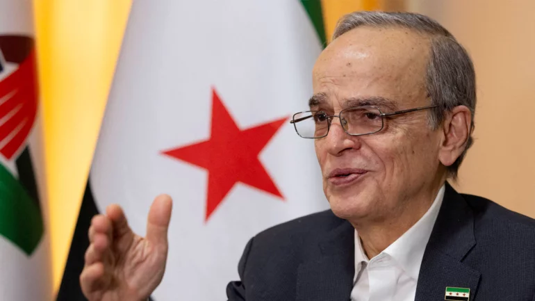 Leader of former Syrian opposition says transitional government should not exclude any party